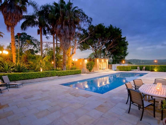 Sandstone pool paving and bluenosed coping.