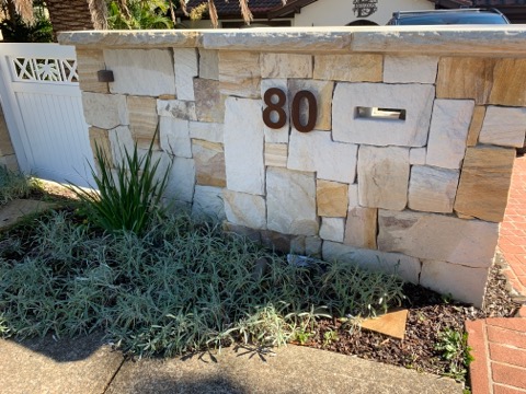 Sandstone Cladding Wall, dry-pack random square split-faced.