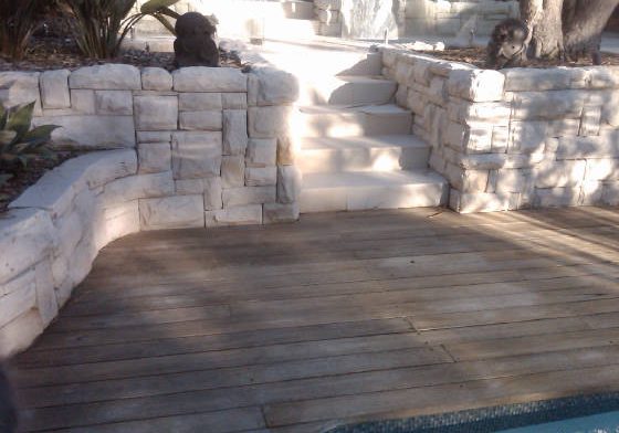 sandstone ballast blocks cut into a medium join dry pack wall.