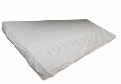Rock-faced wall capping rock-faced step tread or wall capping and coping.